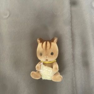 Calico creature one of two of the baby set